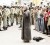 Soldiers stand near opposition supporters during prayers near Tahrir Square in Cairo yesterday. (REUTERS/Suhaib Salem)