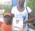 Corletta Wilson (right) and her eight-year-old son Careem, hold up a photo of Radain Wilson, her two-year-old who died after he was locked in a car and forgotten.