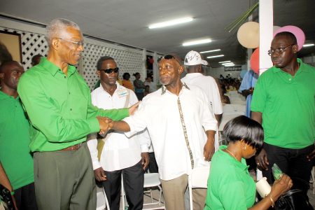 Former Caricom economist Carl Greenidge congratulates PNCR presidential candidate David Granger last night, after losing to him by a slim 15-vote margin at the PNCR Special Congress at Congress Place, Sophia. (Photo by Aubrey Crawford)