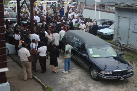 Mourners in the compound of St Andrew’s Kirk, Brickdam and High Street following the funeral service of Mrs Joyce Hoyte this afternoon. (Jules Gibson photo)