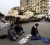 Protesters pray in front of Army tanks during a mass demonstration against the government in Tahrir Square in Cairo February 1, 2011. REUTERS/Yannis Behrakis
