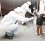 Officials in protective gear check for signs of radiation on children who are from the evacuation area near the Fukushima Daini nuclear plant in Koriyama, yesterday. (REUTERS/Kim Kyung-Hoon)