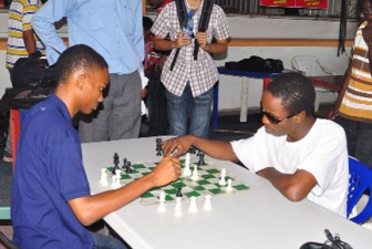 Anthony Drayton, left and Wendell Meusa ran out junior and senior winners of the Topco Juices sponsored Rapid Chess tournament yesterday. (Orlando Charles photo)