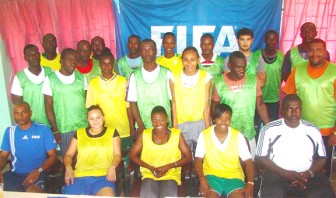 Course Instructors Roy McArthur (seated left) and Ingram Johnson (right) with the participants of the three-day Football Referees Beginners Course.