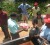 Neaz Subhan (second-left) and other members of the IAC distributing food stuff and cleaning aids to residents of New Forest Canje, Berbice recently.