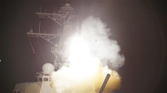 Arleigh Burke-class guided-missile destroyer USS Stout (DDG 55) launches a Tomahawk missile in support of Operation Odyssey Dawn in the Mediterranean Sea on March 19, 2011 in this handout photo released to Reuters on Saturday. This was one of approximately 110 cruise missiles fired from U.S. and British ships and submarines that targeted about 20 radar and anti-aircraft sites along Libya's Mediterranean coast. REUTERS/Jeramy Spivey/U.S. Navy photo/Handout