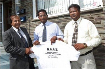 From left, Treasurer Leakh Bhoge, President John Mootooveren and Vice President Bhisham Nandalall pose for a portrait in front of the Guyanese American Association of Schenectady building Monday at 1001 State St. (Daily Gazette.Com photo)