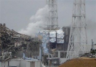 A handout photo shows Tokyo Electric Power Co. Fukushima Daiichi Nuclear Power Plant reactor no. 4 (center) and no. 3 (L) in northern Japan March 15, 2011. Picture taken March 15, 2011. REUTERS/Tokyo Electric Power Co.