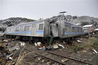 A damaged train is seen after an earthquake and tsunami in Matsushima City, Miyagi Prefecture March 12, 2011. REUTERS/Yomiuri