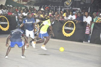 Action in the Guinness Greatest of the Streets football tournament in Linden.