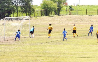 In this Orlando Charles photo, Queen’s College and Tucville Secondary school contest the opening match up of the ScotiaBank/Pepsi Schools Football Tournament.