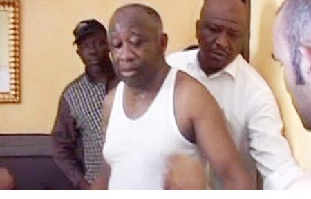 Ivory Coast’s Laurent Gbagbo changes his clothes after being arrested. Photograph: Reuters
