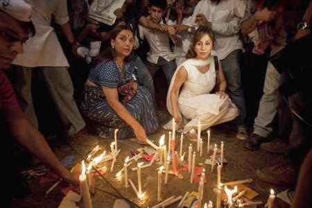 Bollywood personalities Shabana Azmi (L) and Urmila Matondkar light candles during a candle light vigil against corruption in Mumbai April 8, 2011. Veteran social activist Anna Hazare, whose hunger strike against corruption is drawing growing support, rejected on Friday an offer of talks saying the government was ignoring the wishes of the people. Thousands of Indians held demonstrations across the country for another day on Friday in support of Hazare, who is demanding a tough anti-corruption law. REUTERS/Vivek Prakash 