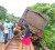 This truck which damaged the bridge leading to Lethem dangles on the damaged bridge on Friday.