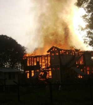 The building ablaze this morning (Photo by Cathy Richards)