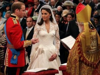 Prince William, and Kate Middleton stand before the Archbishop of Canterbury, Rowan Williams, during their wedding ceremony In Westminster Abbey, in central London today. REUTERS/Dominic Lipinski/Pool