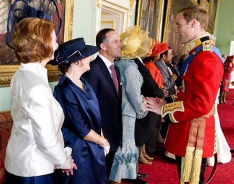 Prince William (R) meets New Zealand's Prime Minister John Key and his wife Bronagh Key at Buckingham Palace in London April 29, 2011. REUTERS/Ian West/POOL