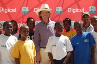 Music legend and Rolling Stones lead singer, Mick Jagger, meets some aspiring young cricketers at the second Digicel ODI today in St. Lucia.   (Digicel photo)