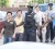 Chinese nationals from left Liu Chun Bao, Chu Cheng An, Tian Ke Fa, Qi Cai Su and Canming Su are escorted to court yesterday. (Trinidad Guardian photo) 