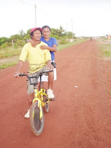 Tabatinga resident Eric Scipio and his wife Elfreida on their way to work at the commercial zone on the outskirts of Lethem recently.