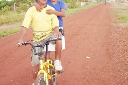 Tabatinga resident Eric Scipio and his wife Elfreida on their way to work at the commercial zone on the outskirts of Lethem recently.