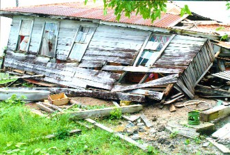 The collapsed home of Patricia Fraser.