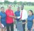 In photo, Babb presents one of the items to representative of the Guyana Rugby Football Union John Lewis, while the three W.I selectees Nicole Nero, Suban Grey and Grace Jarvis look on.