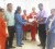 Yogindra Arjune (second from right) of NAFICO as he hands over the cheque to a representative from RSI. Raj Singh (second from left) and other RSI employees look on. 