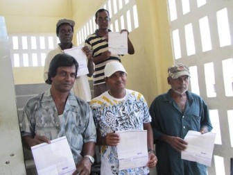 Some of the diamond workers with their cheques (GINA photo)