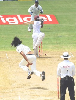 Ishant Sharma gets Adrian Barath to glove a pull onto the stumps.