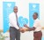 Terron Alleyne accepts his award from Randulph Sears, Officer-in-Charge of the Republic Bank (Guyana) Limited’s Linden branch. 