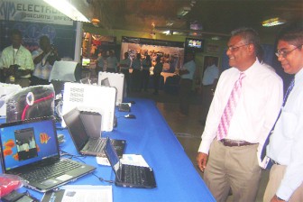 Minister of Labour, Manzoor Nadir (second from right) takes a look at the BOSCH Access Easy Control System, one of the products being offered by Neal and Massy Services Limited, and which are on display at the two-day expo at their facilities in Ruimveldt. 