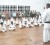 GKC vice chairman and 6th Dan Jeffrey Wong instructs karatekas as their guardians look on, during the ceremony held at the Malteenoes Dojo. 