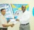 President of the Guyana Chess Federation Shiv Nandalall, left, receives the sponsorship cheque from Banks DIH Brand Manager Clayton Mc Kenzie yesterday.