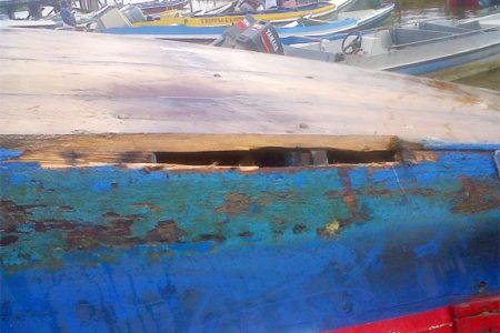 The hole in the boat which caused it to take in water and capsize in Essequibo River. (Photo by Roxanne Clarke)