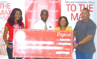 Fiona Harris (second right) collects the cheque from Digicel’s Shonnet Moore (extreme left)       