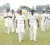 Gudakesh Motie-Kanhai (left) and Anthony Adams (right) lead Guyana off the field after they had bundled Trinidad out for 64.