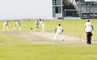 Nino Henry drives during his half century partnership with his captain Rahkeem Cornwall at the GCC ground. (Orlando Charles photo)