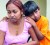 Amanda Ramnath and her brother, Justin, weep yesterday after Friday night's fire at Fyzabad in which their mother, Nowmattie, died. (Trinidad Express photo)