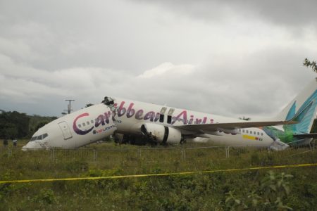 The Caribbean Airlines’ Boeing 737-800, operating as flight BW523, lies broken off the runway at Cheddi Jagan International Airport, Timehri, Guyana today. (Photo by Aubrey Crawford)