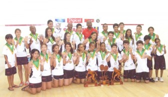 The overall champions, Guyana pose with their trophies and medals at the closing ceremony yesterday at the Georgetown Club Courts.         