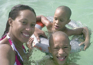 Vonetta Haynes-Reyes and her two sons, Malik, eight, and Makasi, four, enjoy an outing in a pool in this family album photo.