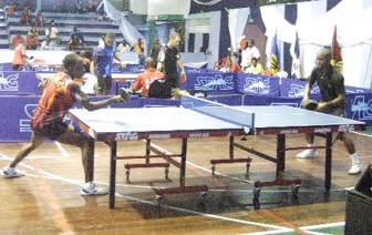 National Champion, Nigel Bryan plays a forehand shot during one of his matches in the group stages.