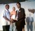 Terron Alleyne receives his award from GT&T CEO Yog Mahadeo