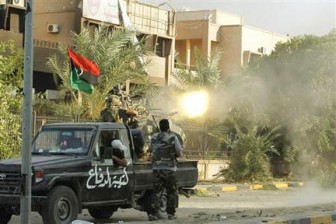 A Libyan rebel fighter fires his heavy machine gun during a fight for the final push to flush out Muammar Gaddafi’s forces in Abu Salim district in Tripoli yesterday.