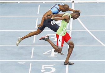 Kirani James of Grenada (R) lunges at the finish line ahead of LaShawn Merritt of the U.S. to win the men’s 400 metres final at the IAAF World Championships in Daegu yesterday. James chased down defending champion Merritt on the home straight to win 400 metres gold and Grenada’s first medal at the world championships  yesterday. REUTERS/Kim Kyung-Hoon