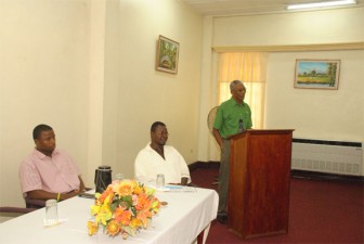 Brigadier Granger giving his presentation at the Youth Symposium hosted by the Community College yesterday.  Seated at the table (at left) is AFC representative Trevor Williams. (Photo by Aubrey Crawford)