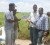 Dr Mahendra Persaud (right) and farmers examine rice that is said to be of a high yield.