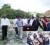 Mourners carry the casket with 91-year-old Adolphus James to his final resting place. Inset is a photo of close family members.