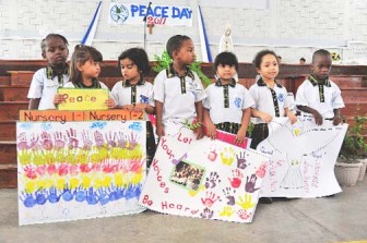 Marian Nursery students presenting their peace posters. (Photo by Megan de Haas)